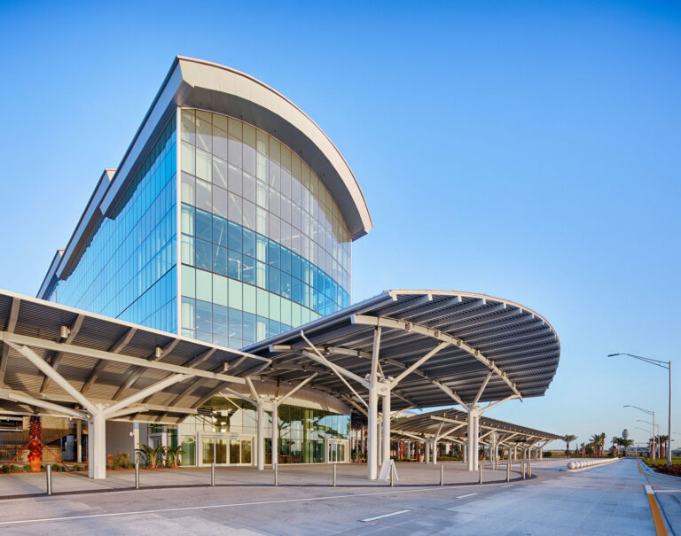 A photo of the exterior of a new building up against sunny skies.